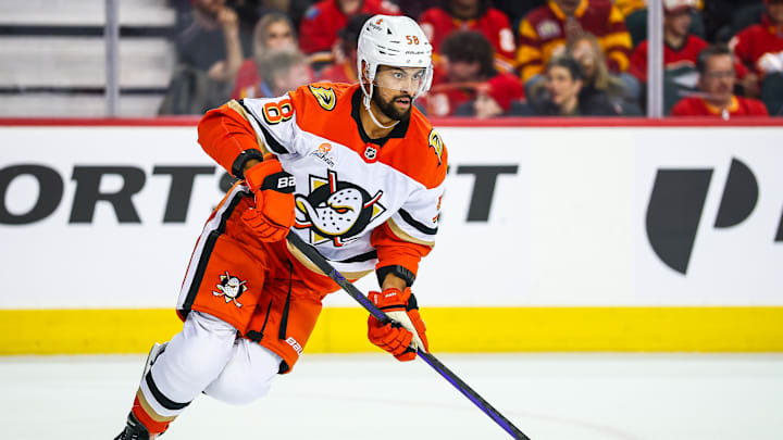 Apr 3, 2025; Calgary, Alberta, CAN; Anaheim Ducks defenseman Oliver Kylington (58) skates against the Calgary Flames during the second period at Scotiabank Saddledome. Mandatory Credit: Sergei Belski-Imagn Images