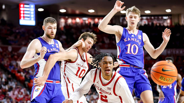 Oklahoma guard Javian McCollum (2), Oklahoma forward Sam Godwin (10), Kansas center Hunter Dickinson (1), Kansas guard Johnny Furphy (10)