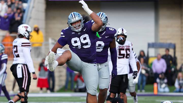 Kansas State Wildcats defensive tackle Uso Seumalo celebrates a sack against Texas Tech Red Raiders QB Behren Morton.