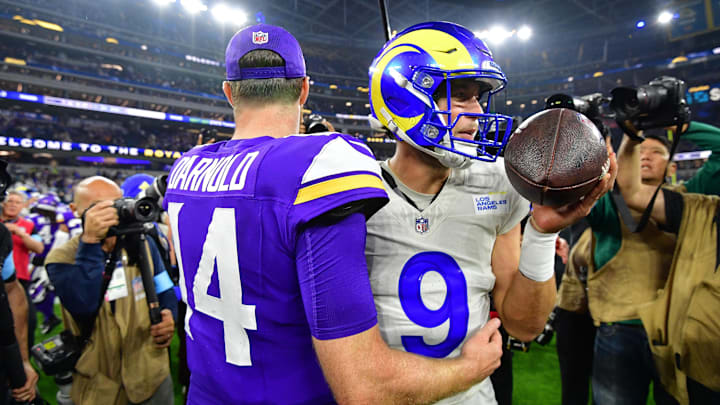 Oct 24, 2024; Inglewood, California, USA; Minnesota Vikings quarterback Sam Darnold (14) meets with Los Angeles Rams quarterback Matthew Stafford (9) following the game at SoFi Stadium.