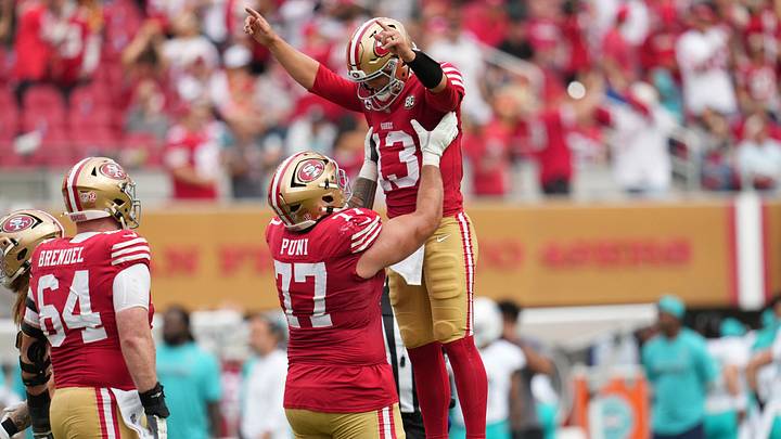 Sep 20, 2026; Santa Clara, California, USA; San Francisco 49ers quarterback Brock Purdy (13) celebratse with offensive line Dominick Puni (77) during the third quarter against the Miami Dolphins at Levi's Stadium. Mandatory Credit: Cary Edmondson-Imagn Images Sep 20, 2026; Santa Clara, California, USA; San Francisco 49ers quarterback Brock Purdy (13) celebratse with offensive line Dominick Puni (77) during the third quarter against the Miami Dolphins at Levi's Stadium. Mandatory Credit: Cary Edmondson-Imagn Images