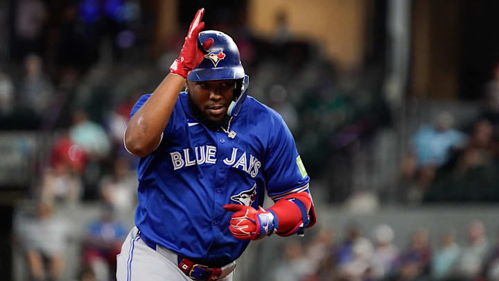 Sep 19, 2024; Arlington, Texas, USA; Toronto Blue Jays first baseman Vladimir Guerrero Jr. (27) reacts after hitting a solo home run during the ninth inning against the Texas Rangers at Globe Life Field. Mandatory Credit: Raymond Carlin III-Imagn Images