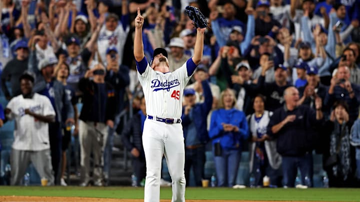 Oct 20, 2024; Los Angeles, California, USA; Los Angeles Dodgers pitcher Blake Treinen (49) celebrates after beating the New York Mets during Game 6 of the NLCS for the 2024 MLB playoffs at Dodger Stadium. Oct 20, 2024; Los Angeles, California, USA; Los Angeles Dodgers pitcher Blake Treinen (49) celebrates after beating the New York Mets during Game 6 of the NLCS for the 2024 MLB playoffs at Dodger Stadium.
