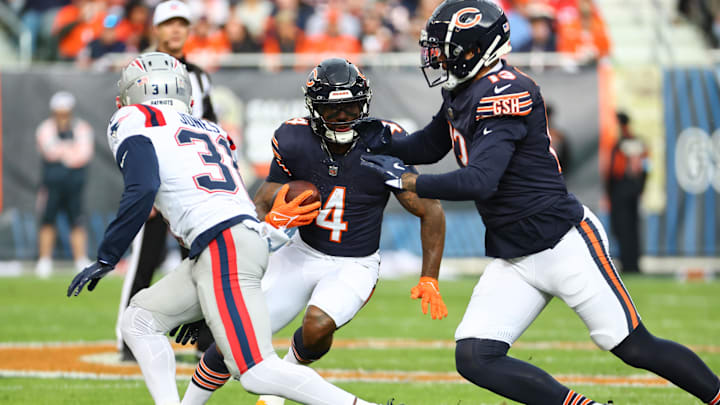 D'Andre Swift looks across the line for running room during Sunday's 19-3 loss to New England. 
