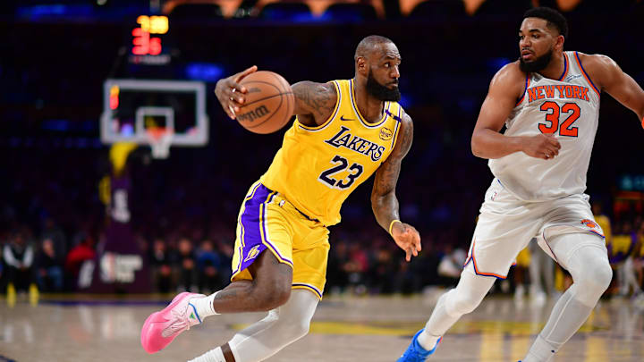 Mar 6, 2025; Los Angeles, California, USA; Los Angeles Lakers forward LeBron James (23) moves to the basket against New York Knicks center Karl-Anthony Towns (32) during the second half at Crypto.com Arena. Mandatory Credit: Gary A. Vasquez-Imagn Images