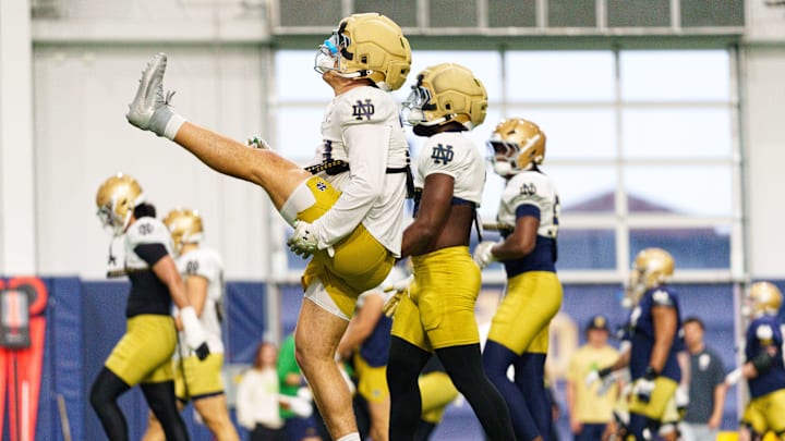 Players warm up during a Notre Dame football practice at Irish Athletic Center on Saturday, April 18, 2026, in South Bend.
