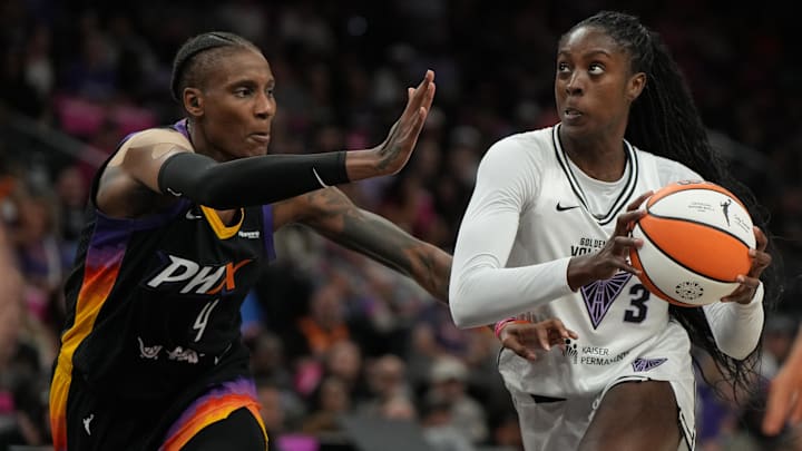 Aug 22, 2025; Phoenix, Arizona, USA; Golden State Valkyries forward Laeticia Amihere (3) drives on Phoenix Mercury forward Natasha Mack (4) in the first half at Footprint Center. Mandatory Credit: Rick Scuteri-Imagn Images