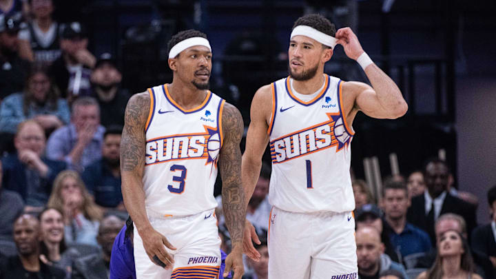 Apr 12, 2024; Sacramento, California, USA; Phoenix Suns guard Bradley Beal (3) and guard Devin Booker (1) walk off the court during a time out in the second quarter against the Sacramento Kings at Golden 1 Center. Mandatory Credit: Ed Szczepanski-Imagn Images