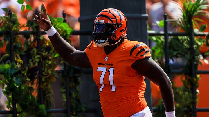 Sep 14, 2025; Cincinnati, Ohio, USA; Cincinnati Bengals offensive tackle Amarius Mims (71) runs onto the field before the game against the Jacksonville Jaguars at Paycor Stadium. Mandatory Credit: Katie Stratman-Imagn Images