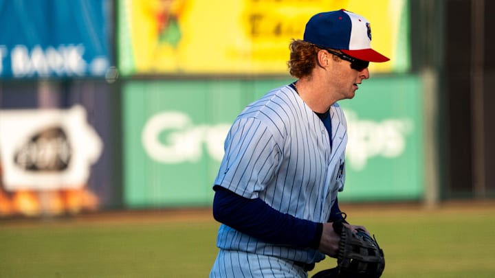Iowa Cubs' Owen Caissie runs toward the dugout during a game against the Toledo Mud Hens at Principal Park on Tuesday, April 2, 2024, in Des Moines.