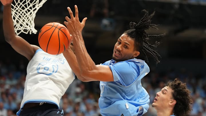 Oct 4, 2025; Charlotte, NC, USA; North Carolina Tar Heels forward Jarin Stevenson (15) and forward Caleb Wilson (8) fight for a rebound in the first half at Dean E. Smith Center. Mandatory Credit: Bob Donnan-Imagn Images Oct 4, 2025; Charlotte, NC, USA; North Carolina Tar Heels forward Jarin Stevenson (15) and forward Caleb Wilson (8) fight for a rebound in the first half at Dean E. Smith Center. Mandatory Credit: Bob Donnan-Imagn Images