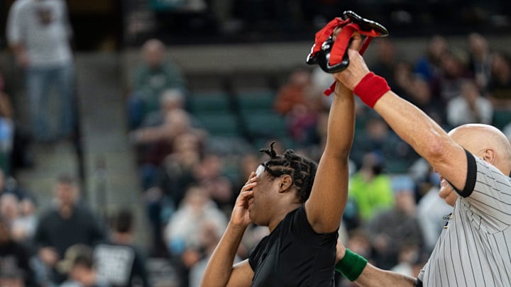 John F. Kennedy’s Solaris Paul reacts after defeating Newton/Kittatinny’s Paige Caro in the championship 165lb match during finals of the NJSIAA individual girls wrestling state championships at Boardwalk Hall in Atlantic City on Friday, March 8, 2025.
