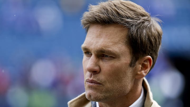 Oct 27, 2024; Seattle, Washington, USA; FOX commentator Tom Brady stands on the sideline before a game between the Seattle Seahawks and Buffalo Bills at Lumen Field. Mandatory Credit: Joe Nicholson-Imagn Images