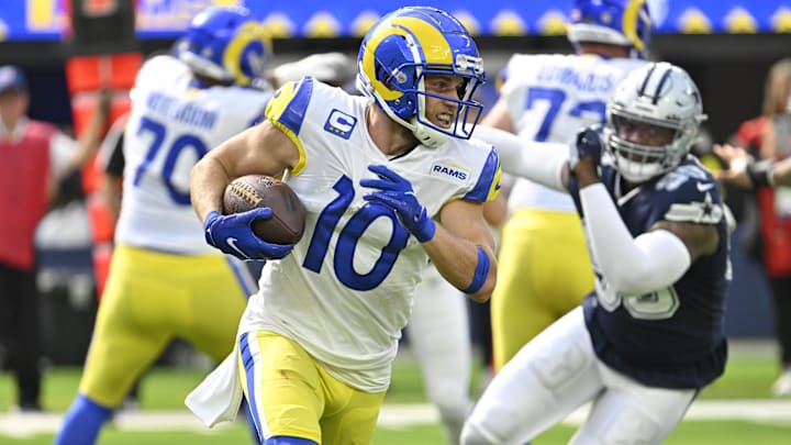 Oct 9, 2022; Inglewood, California, USA; Los Angeles Rams wide receiver Cooper Kupp (10) carries the ball during the second quarter against the Dallas Cowboys at SoFi Stadium. Mandatory Credit: Robert Hanashiro-Imagn Images