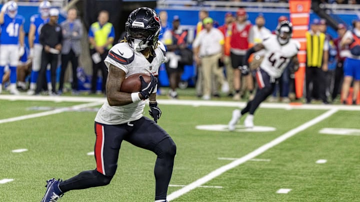 Aug 23, 2025; Detroit, Michigan, USA; Houston Texans cornerback Jalen Mills (26) runs with the ball after his interception against the Detroit Lions during the second half at Ford Field. Mandatory Credit: David Reginek-Imagn Images