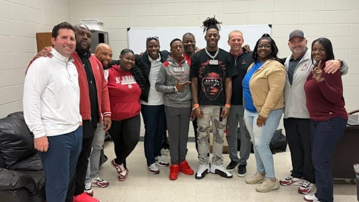 2026 wide receiver Cederian Morgan alongside members of the Alabama coaching staff. 