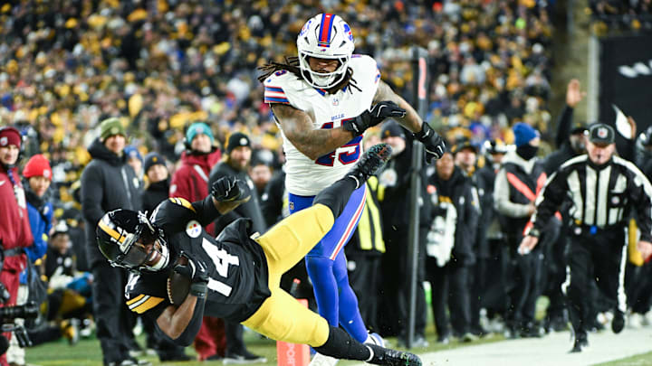 Nov 30, 2025; Pittsburgh, Pennsylvania, USA; Pittsburgh Steelers running back Kenneth Gainwell (14) is tackled out of bounds by Buffalo Bills linebacker Shaq Thompson (45) during the second quarter at Acrisure Stadium.