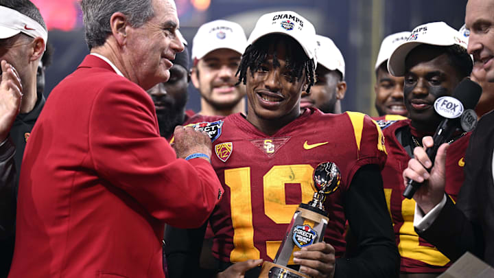Dec 27, 2023; San Diego, CA, USA; USC Trojans safety Jaylin Smith (19) is presented the defensive MVP trophy after defeating the Louisville Cardinals at Petco Park. 