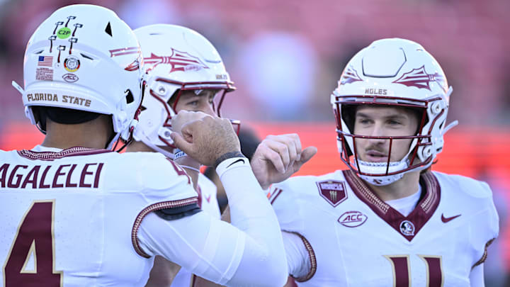 Sep 28, 2024; Dallas, Texas, USA; Florida State Seminoles quarterback DJ Uiagalelei (4) and quarterback Luke Kromenhoek (14) and quarterback Brock Glenn (11) before the game between the Southern Methodist Mustangs and the Florida State Seminoles at Gerald J. Ford Stadium. Mandatory Credit: Jerome Miron-Imagn Images Sep 28, 2024; Dallas, Texas, USA; Florida State Seminoles quarterback DJ Uiagalelei (4) and quarterback Luke Kromenhoek (14) and quarterback Brock Glenn (11) before the game between the Southern Methodist Mustangs and the Florida State Seminoles at Gerald J. Ford Stadium. Mandatory Credit: Jerome Miron-Imagn Images