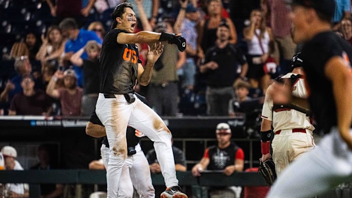 Jun 13, 2025; Omaha, Neb, USA; Oregon State Beavers shortstop Aiva Arquette (13) celebrates after scoring to defeat the Louisville Cardinals at Charles Schwab Field. Mandatory Credit: Dylan Widger-Imagn Images