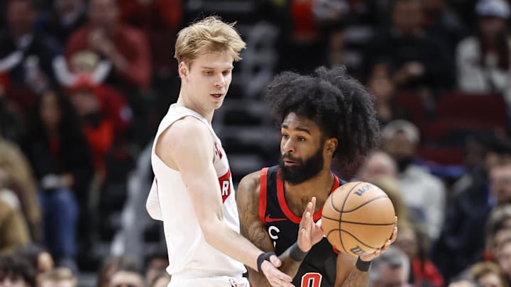 Jan 30, 2024; Chicago, Illinois, USA; Chicago Bulls guard Coby White (0) looks to pass the ball against Toronto Raptors guard Gradey Dick (1) during the first half at United Center. Mandatory Credit: Kamil Krzaczynski-Imagn Images