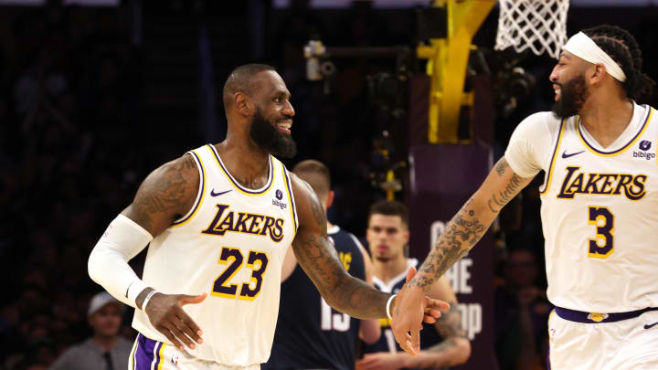 Apr 27, 2024; Los Angeles, California, USA; Los Angeles Lakers forward LeBron James (23) and forward Anthony Davis (3) celebrate after a basket during the fourth quarter in game four of the first round for the 2024 NBA playoffs against the Denver Nuggets at Crypto.com Arena. Mandatory Credit: Jason Parkhurst-USA TODAY Sports