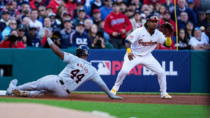 Detroit Tigers designated hitter Justyn-Henry Malloy (44) slides into third base against Cleveland Guardians third base José Ramírez (11) during the second inning of Game 2 of ALDS at Progressive Field in Cleveland, Ohio on Monday, Oct. 7, 2024.