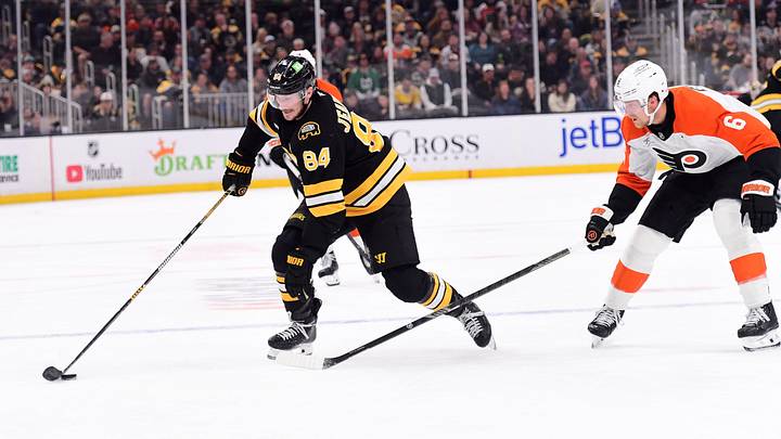 Oct 10, 2026; Boston, Massachusetts, USA; Boston Bruins left wing Tanner Jeannot (84) controls the puck while Philadelphia Flyers defenseman Travis Sanheim (6) defends during the first period at TD Garden. Mandatory Credit: Bob DeChiara-Imagn Images Oct 10, 2026; Boston, Massachusetts, USA; Boston Bruins left wing Tanner Jeannot (84) controls the puck while Philadelphia Flyers defenseman Travis Sanheim (6) defends during the first period at TD Garden. Mandatory Credit: Bob DeChiara-Imagn Images