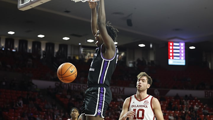 Dec 22, 2024; Norman, Oklahoma, USA; Central Arkansas Bears forward Nehemiah Turner (4) dunks against the Oklahoma Sooners during the first half at Lloyd Noble Center. Mandatory Credit: Alonzo Adams-Imagn Images