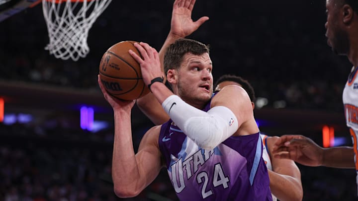 Jan 1, 2025; New York, New York, USA; Utah Jazz center Walker Kessler (24) secures the ball after a rebound during the first half against the New York Knicks at Madison Square Garden. Mandatory Credit: Vincent Carchietta-Imagn Images