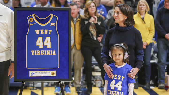 Jan 18, 2025; Morgantown, West Virginia, USA; Karen West, wife of Naismith Memorial Basketball Hall of Famer Jerry West, watches on during a ceremony honoring her late husband at halftime against the Iowa State Cyclones at WVU Coliseum. Mandatory Credit: Ben Queen-Imagn Images