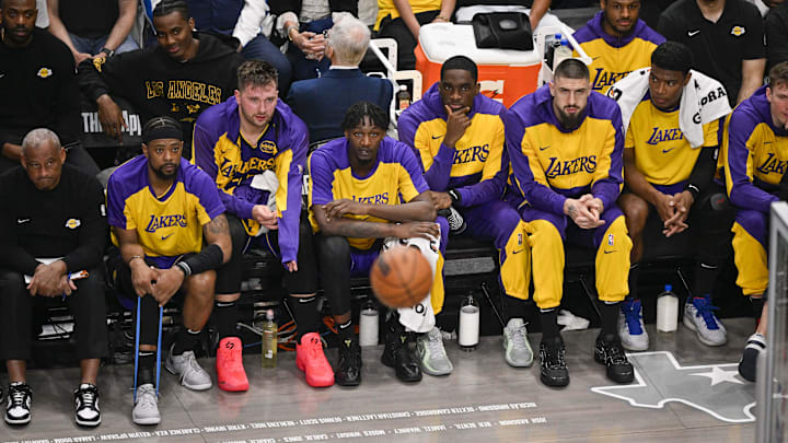 Apr 9, 2025; Dallas, Texas, USA; Los Angeles Lakers guard Luka Doncic (77) looks on from the team bench during the game between the Dallas Mavericks and the Los Angeles Lakers at American Airlines Center. Mandatory Credit: Jerome Miron-Imagn Images Apr 9, 2025; Dallas, Texas, USA; Los Angeles Lakers guard Luka Doncic (77) looks on from the team bench during the game between the Dallas Mavericks and the Los Angeles Lakers at American Airlines Center. Mandatory Credit: Jerome Miron-Imagn Images
