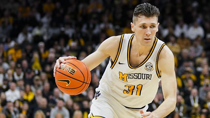 Feb 8, 2025; Columbia, Missouri, USA; Missouri Tigers guard Caleb Grill (31) drives during the first half against the Texas A&M Aggies at Mizzou Arena. Mandatory Credit: Jay Biggerstaff-Imagn Images