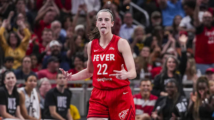 Sep 13, 2024; Indianapolis, Indiana, USA;  Indiana Fever guard Caitlin Clark (22) reacts to scoring a 3-pointer Friday, Sept. 13, 2024, during a game between the Indiana Fever and the Las Vegas Aces on Friday, Sept. 13, 2024, at Gainbridge Fieldhouse in Indianapolis. The Aces defeated the Fever, 78-74.  Mandatory Credit:  Grace Smith/USA TODAY Network via Imagn Images