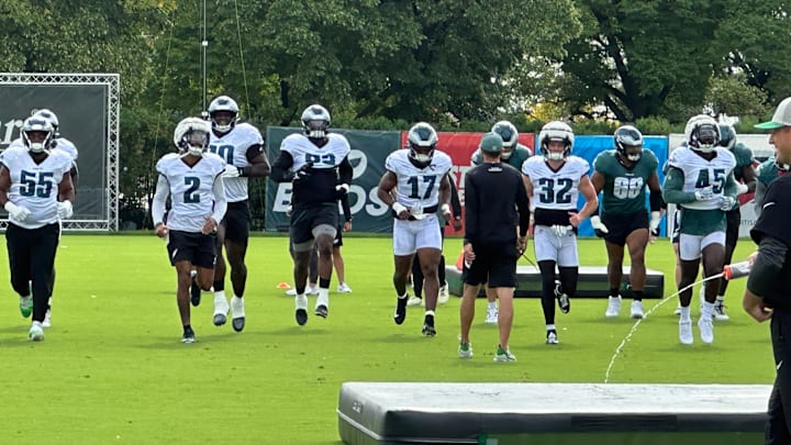 Eagles defense goes through some pre-practice warmups during training camp.