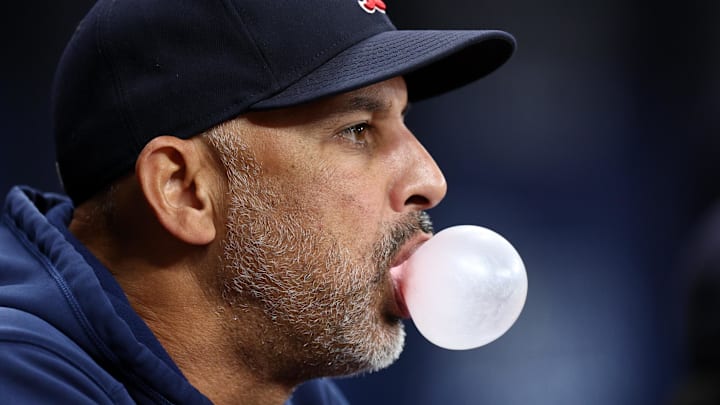 Sep 19, 2024; St. Petersburg, Florida, USA; Boston Red Sox manager Alex Cora (13) looks on from the dugout against the Tampa Bay Rays in the fourth inning at Tropicana Field. Mandatory Credit: Nathan Ray Seebeck-Imagn Images