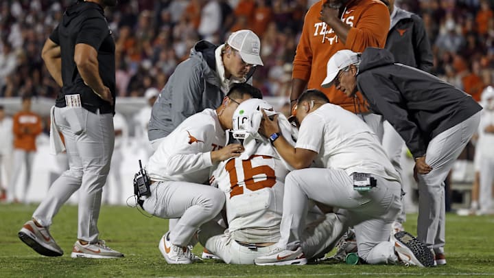 Oct 25, 2025; Starkville, Mississippi, USA; Medical staff check on Texas Longhorns quarterback Arch Manning (16) during overtime against the Mississippi State Bulldogs at Davis Wade Stadium at Scott Field. Mandatory Credit: Petre Thomas-Imagn Images Oct 25, 2025; Starkville, Mississippi, USA; Medical staff check on Texas Longhorns quarterback Arch Manning (16) during overtime against the Mississippi State Bulldogs at Davis Wade Stadium at Scott Field. Mandatory Credit: Petre Thomas-Imagn Images