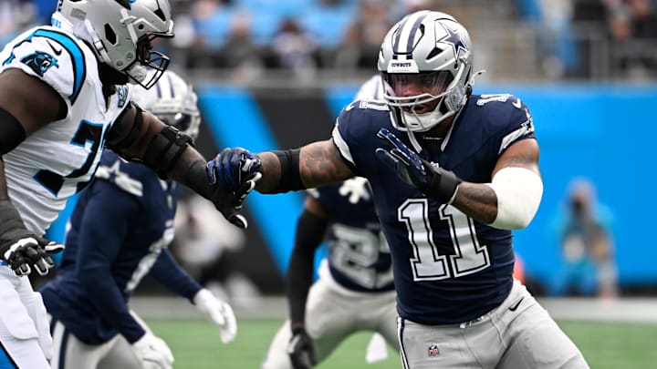 Dallas Cowboys linebacker Micah Parsons (11) rushes as Carolina Panthers offensive tackle Taylor Moton (72) defends in the first quarter at Bank of America Stadium. Dallas Cowboys linebacker Micah Parsons (11) rushes as Carolina Panthers offensive tackle Taylor Moton (72) defends in the first quarter at Bank of America Stadium.
