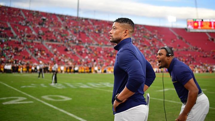 Nov 30, 2024; Los Angeles, California, USA; Notre Dame Fighting Irish head coach Marcus Freeman watches game action against the Southern California Trojans during the second half at the Los Angeles Memorial Coliseum. Mandatory Credit: Gary A. Vasquez-Imagn Images Nov 30, 2024; Los Angeles, California, USA; Notre Dame Fighting Irish head coach Marcus Freeman watches game action against the Southern California Trojans during the second half at the Los Angeles Memorial Coliseum. Mandatory Credit: Gary A. Vasquez-Imagn Images