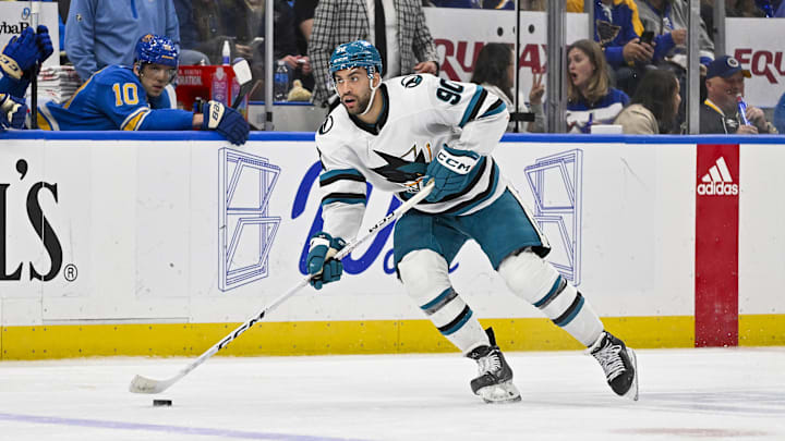 Mar 30, 2024; St. Louis, Missouri, USA;  San Jose Sharks right wing Justin Bailey (90) controls the puck against the St. Louis Blues during the third period at Enterprise Center. Mandatory Credit: Jeff Curry-Imagn Images