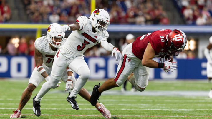 Sep 16, 2023; Indianapolis, Indiana, USA; Indiana Hoosiers tight end Bradley Archer (82) runs the ball against Louisville Cardinals defensive back Quincy Riley (3) 