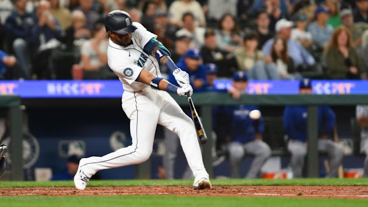 Seattle Mariners right fielder Victor Robles hits a single during a game against the Texas Rangers on Thursday at T-Mobile Park. Seattle Mariners right fielder Victor Robles hits a single during a game against the Texas Rangers on Thursday at T-Mobile Park.