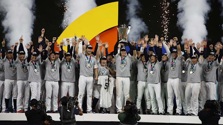 Mar 21, 2023; Miami, Florida, USA;  Japan designated hitter and closing pitcher Shohei Ohtani (16) and team Japan celebrate with the World Baseball Classic trophy after defeating the USA in the World Baseball Classic at LoanDepot Park. Mandatory Credit: Rhona Wise-Imagn Images