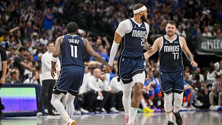 May 13, 2024; Dallas, Texas, USA; Dallas Mavericks guard Kyrie Irving (11) an d center Daniel Gafford (21) and guard Luka Doncic (77) celebrate during the second quarter against the Oklahoma City Thunder in game four of the second round for the 2024 NBA playoffs at American Airlines Center. Mandatory Credit: Jerome Miron-Imagn Images May 13, 2024; Dallas, Texas, USA; Dallas Mavericks guard Kyrie Irving (11) an d center Daniel Gafford (21) and guard Luka Doncic (77) celebrate during the second quarter against the Oklahoma City Thunder in game four of the second round for the 2024 NBA playoffs at American Airlines Center. Mandatory Credit: Jerome Miron-Imagn Images