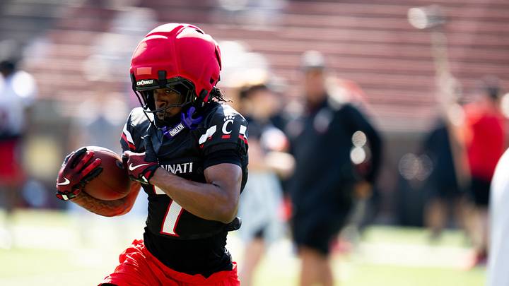 Cincinnati Bearcats safety Ty Goodwill (7) runs with the ball during a drill at UC football training camp at Nippert Stadium in Cincinnati on Wednesday, Aug. 5, 2026.