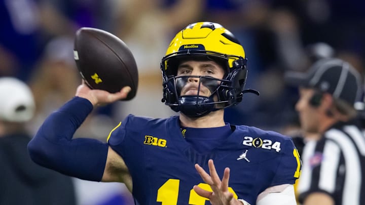 Jan 8, 2024; Houston, TX, USA; Michigan Wolverines quarterback Jack Tuttle (13) against the Washington Huskies during the 2024 College Football Playoff national championship game at NRG Stadium. Mandatory Credit: Mark J. Rebilas-Imagn Images Jan 8, 2024; Houston, TX, USA; Michigan Wolverines quarterback Jack Tuttle (13) against the Washington Huskies during the 2024 College Football Playoff national championship game at NRG Stadium. Mandatory Credit: Mark J. Rebilas-Imagn Images