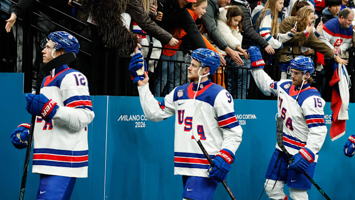 Feb 20, 2026; Milan, Italy; Jack Eichel (9) of the United States greets fans after the game against Slovakia in a men's ice hockey semifinal during the Milano Cortina 2026 Olympic Winter Games at Milano Santagiulia Ice Hockey Arena. Mandatory Credit: Geoff Burke-Imagn Images