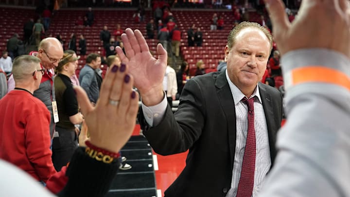 Jan 17, 2023; Madison, Wisconsin, USA;  Wisconsin Badgers head coach Greg Gard high fives fans. Mandatory Credit: Kayla Wolf-Imagn Images