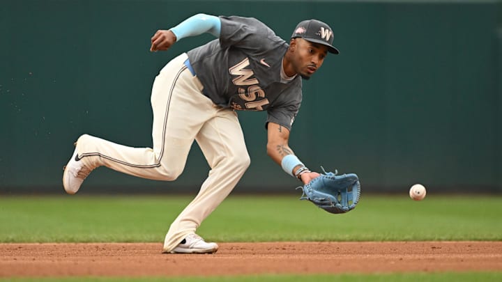 Sep 29, 2024; Washington, District of Columbia, USA; Washington Nationals shortstop Nasim Nunez (26) fields a ground ball against the Philadelphia Phillies during the third inning at Nationals Park.