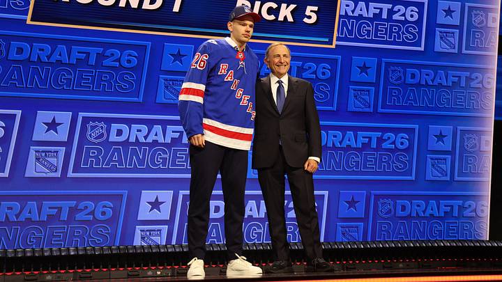 Jun 26, 2026; Buffalo, New York, USA; Alberts Smits reacts beside NHL commissioner Gary Bettman after being selected with the fifth pick in the first round of the 2026 NHL Draft by the New York Rangers at KeyBank Center. Mandatory Credit: Timothy T. Ludwig-Imagn Images